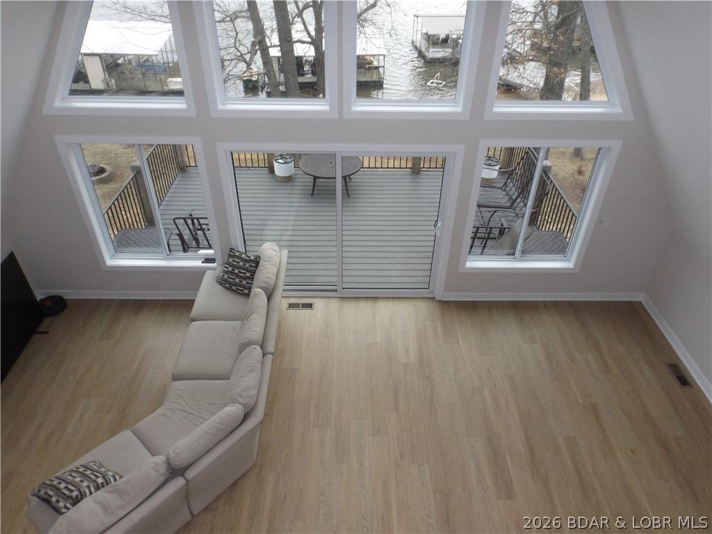 Image 3: Abundant windows to let in natural light.  View is