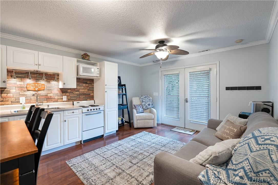 Image 2: Freshly painted condo offers wood laminate floors,