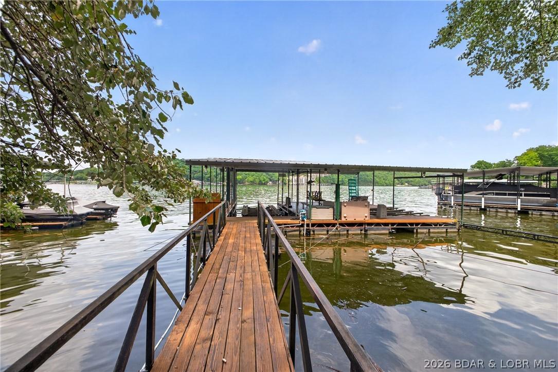 Image 2: Private 2 well dock with boat lift, double PWC lif