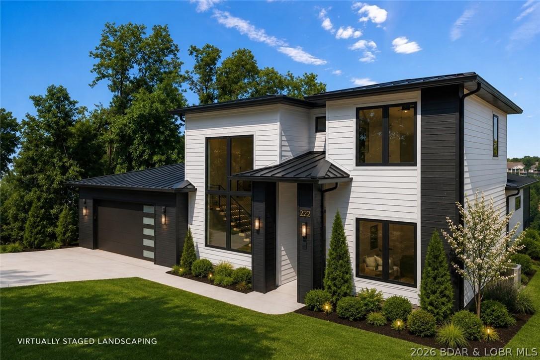 Image 3: Contemporary front elevation featuring an oversize
