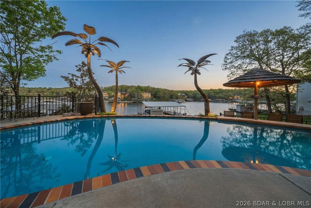 Image 3: The pool and outdoor entertaining area is spectacu