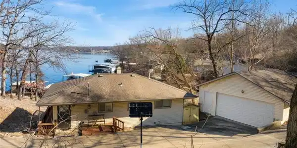 Image 2: Roadside View of Home & Garage
