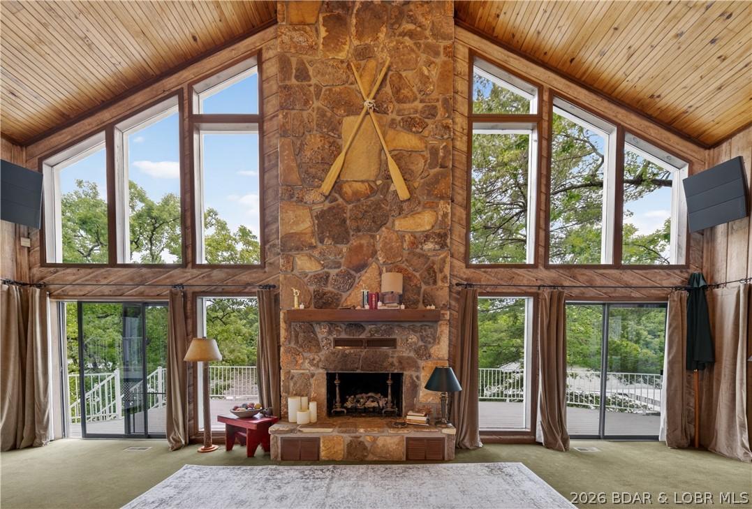 Image 4: Living Room w/ Floor to Ceiling Windows + Fireplac