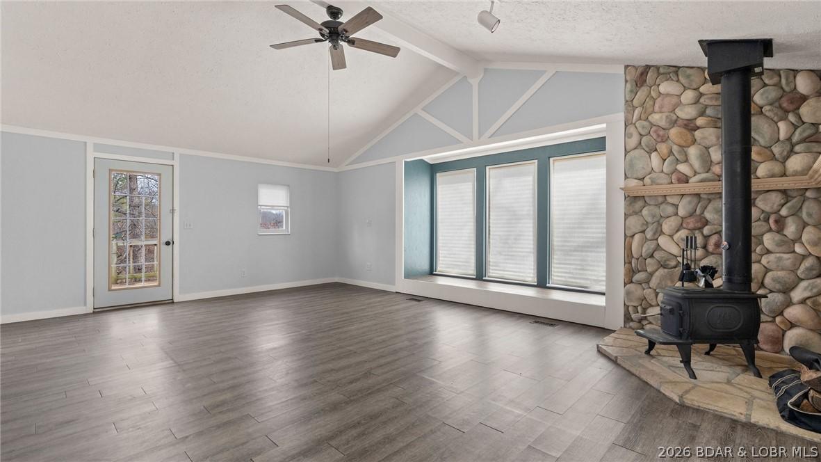 Image 2: Living area with wood burning fireplace