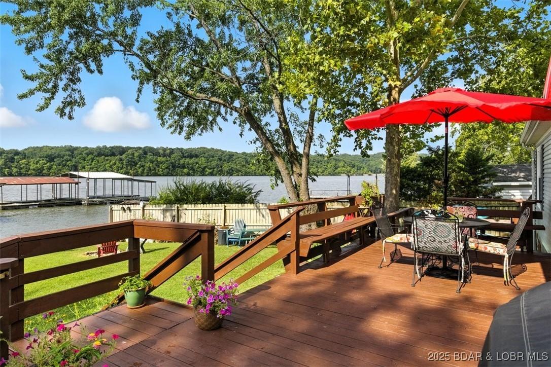 Image 3: Spacious Deck just steps to the Lake