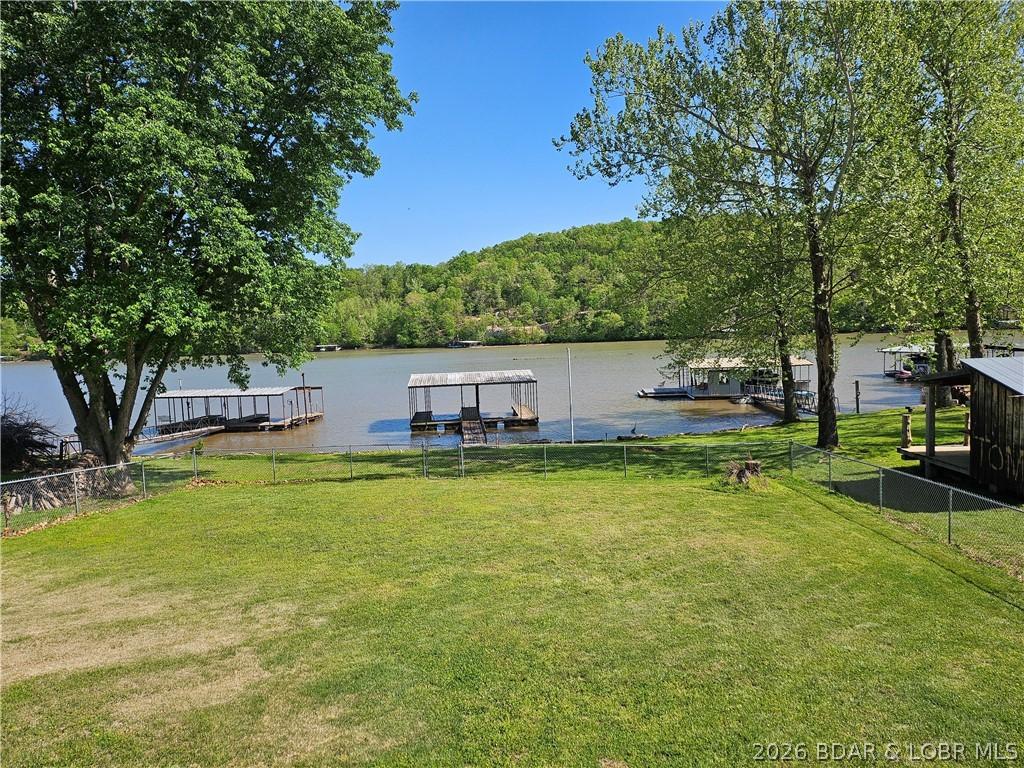 Image 2: View of large lakeside yard looking towards the do