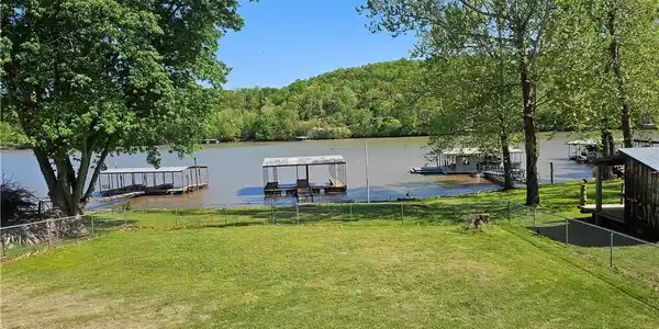 Image 2: View of large lakeside yard looking towards the do