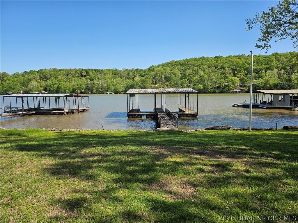 Image 3: View 2 of property between fenced yard and the doc