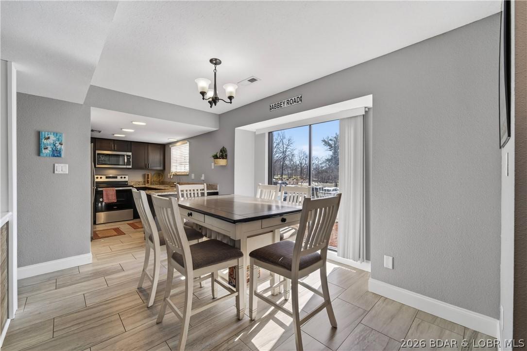 Image 2: Dining area into kitchen-from entry