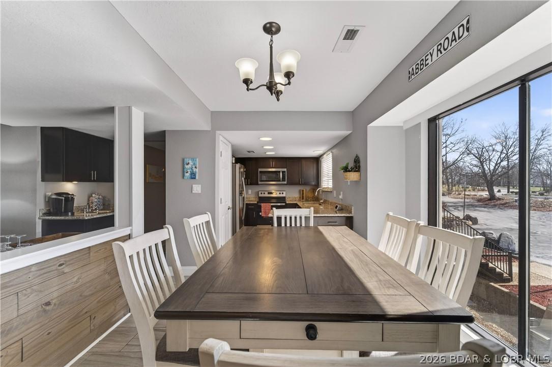 Image 4: Dining area into kitchen from entry