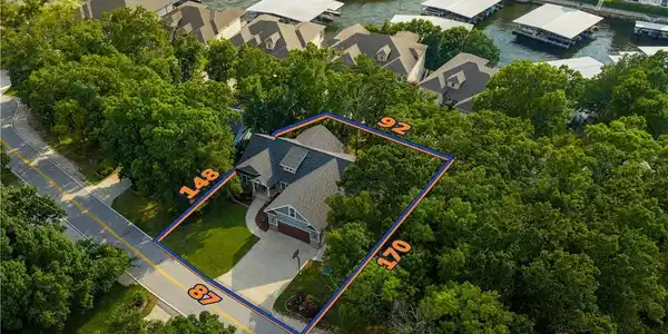 Image 2: Nearly a Perfect Parcel; a front yard and driveway