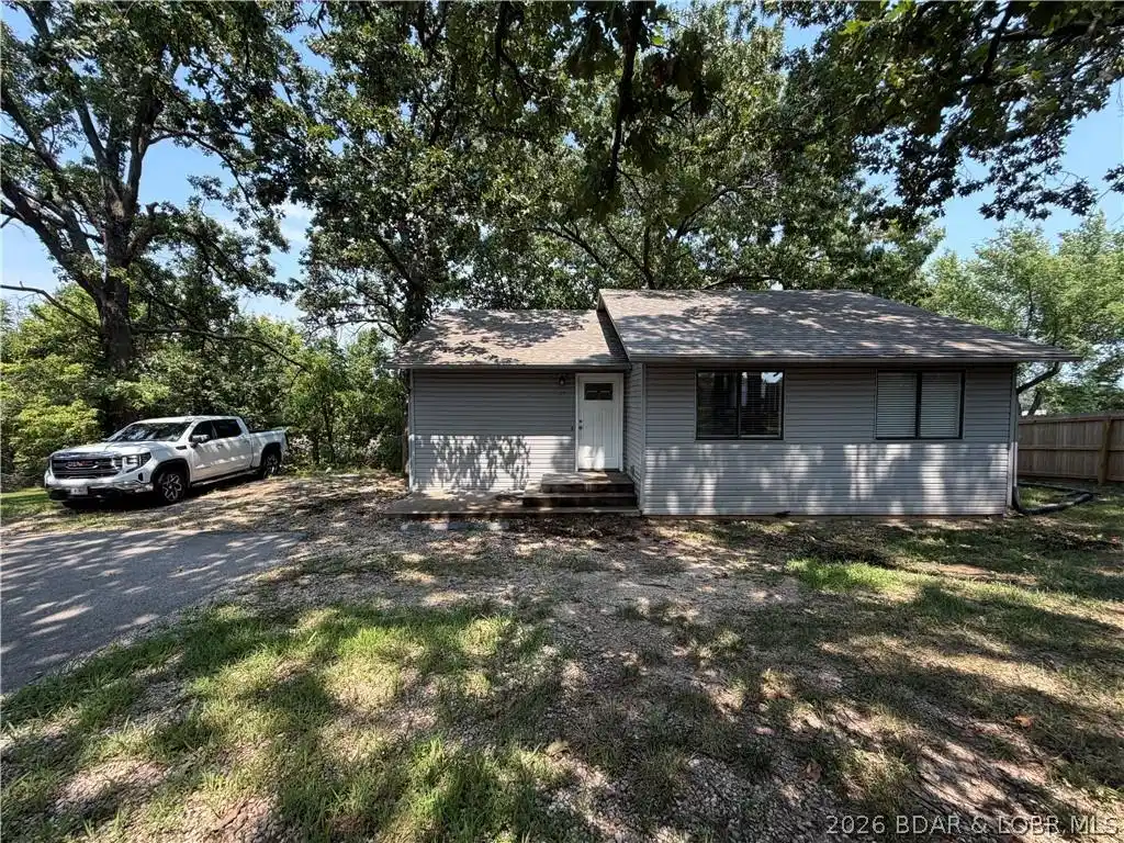 Image 1: Front of house & parking