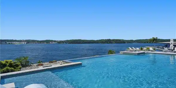 Image 3: Resort-Style Pool Overlooking the Lake