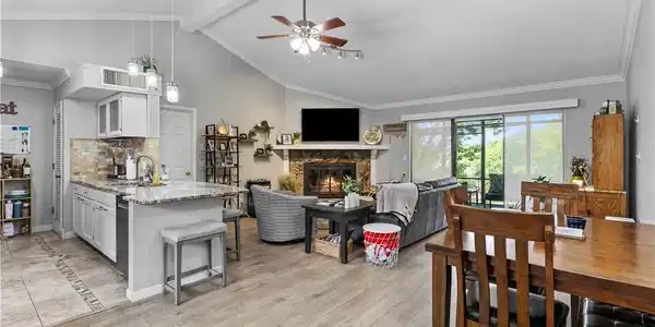 Image 3: Great room with newer LVP, tile in the kitchen.  A