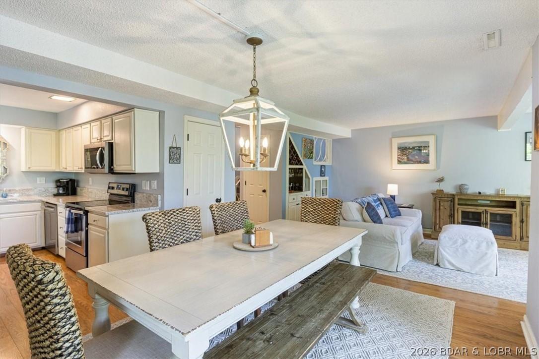 Image 3: Open Living, Dining, and Kitchen