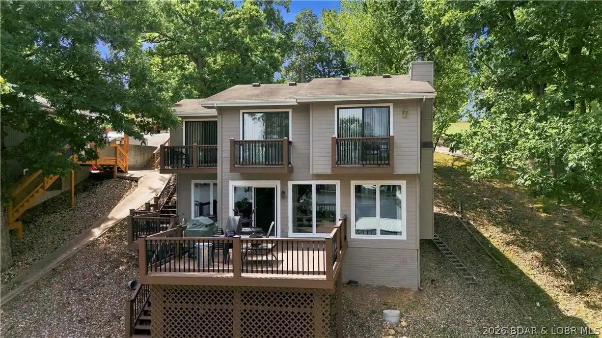 Image 1: Exterior view of the home from the lake side.