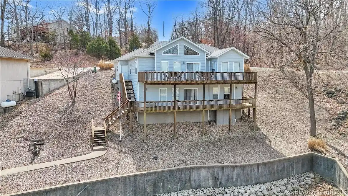 Image 1: View of home from lakeside.