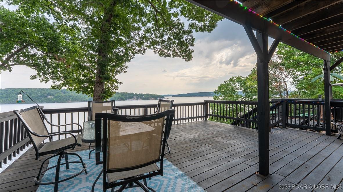 Image 3: Large deck off the living room is partially covere