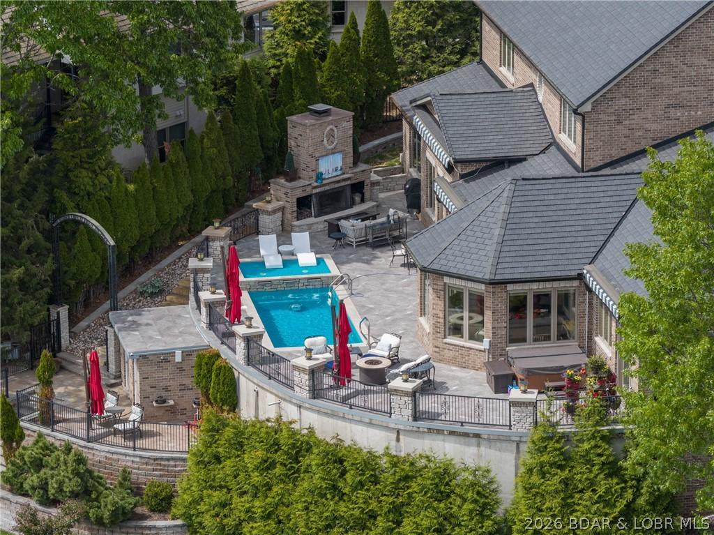Image 2: Pool, hot tub, and firepit all with zero steps fro