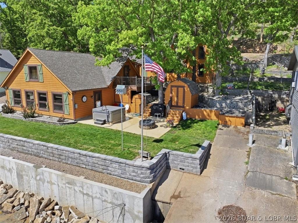 Image 3: Lake front side of this home with new seawall.