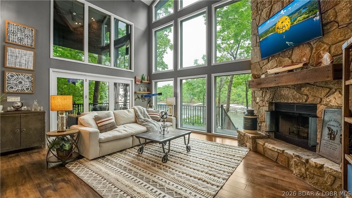 Image 3: Dramatic wall of floor to ceiling windows floods t
