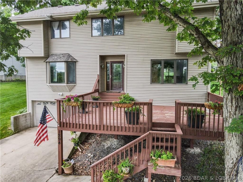 Image 2: Big front entry/deck and plenty of parking
