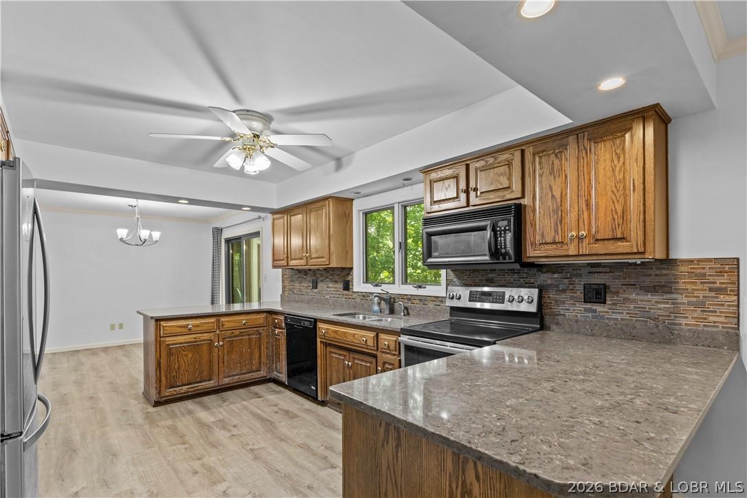 Image 4: Large kitchen with plenty of cabinets and counters