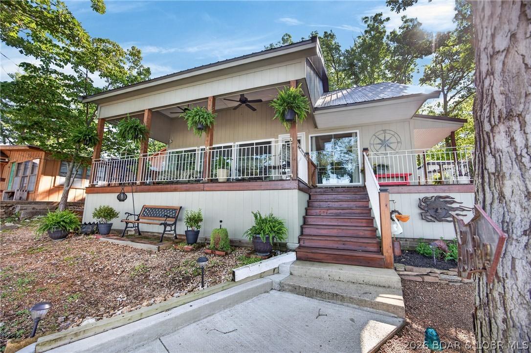 Image 3: The exterior deck and walkway have been remodeled,