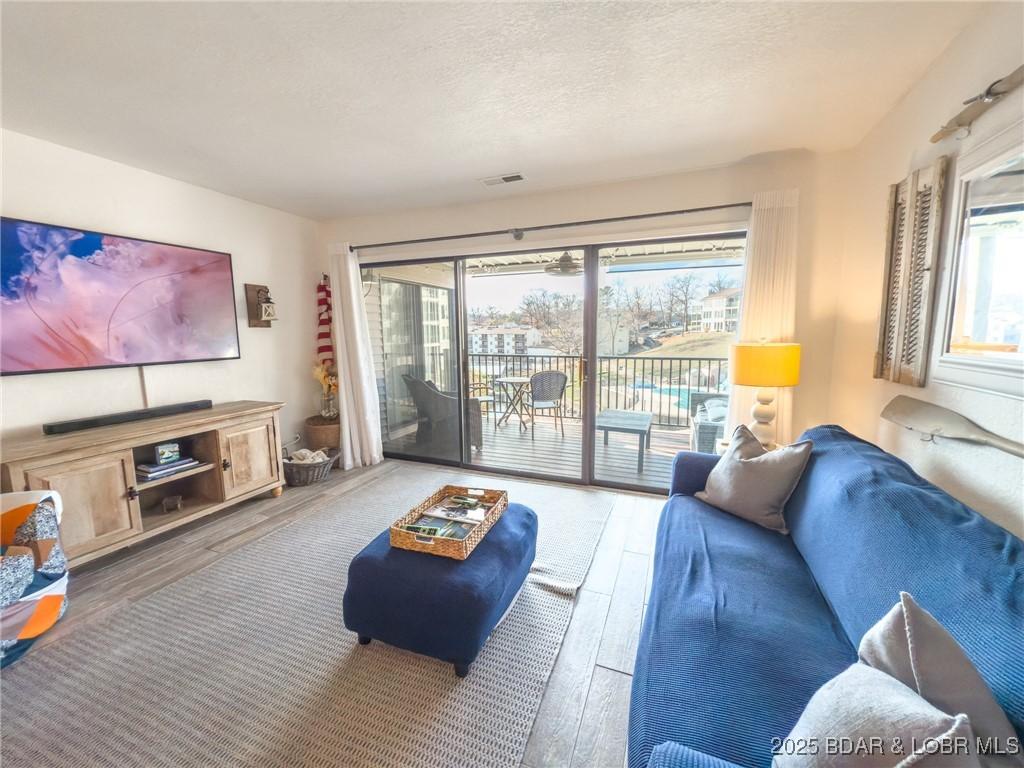 Image 4: Living Area with walk out deck.