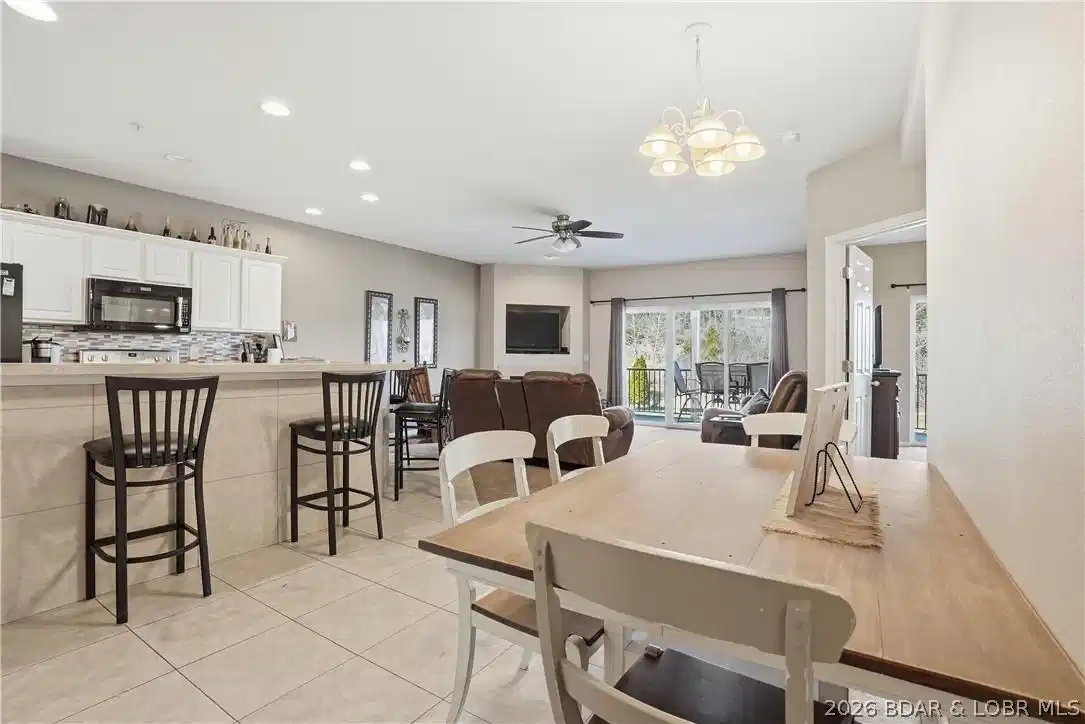 Image 1: Kitchen, Dining Area, and Living Room