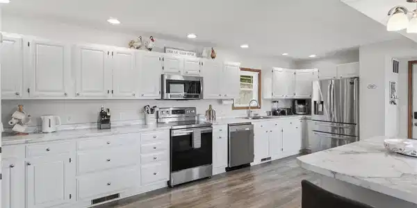 Image 4: Stunning, oversized kitchen featuring modern finis
