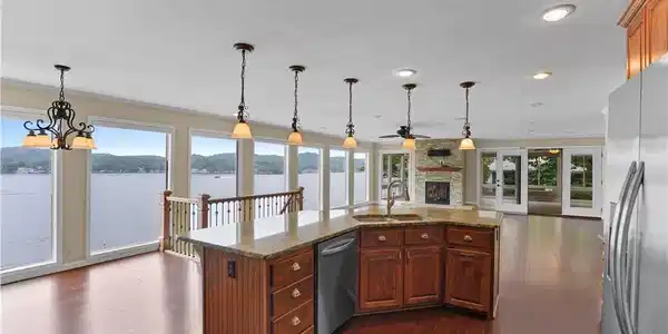 Image 3: Open-concept kitchen with lake views