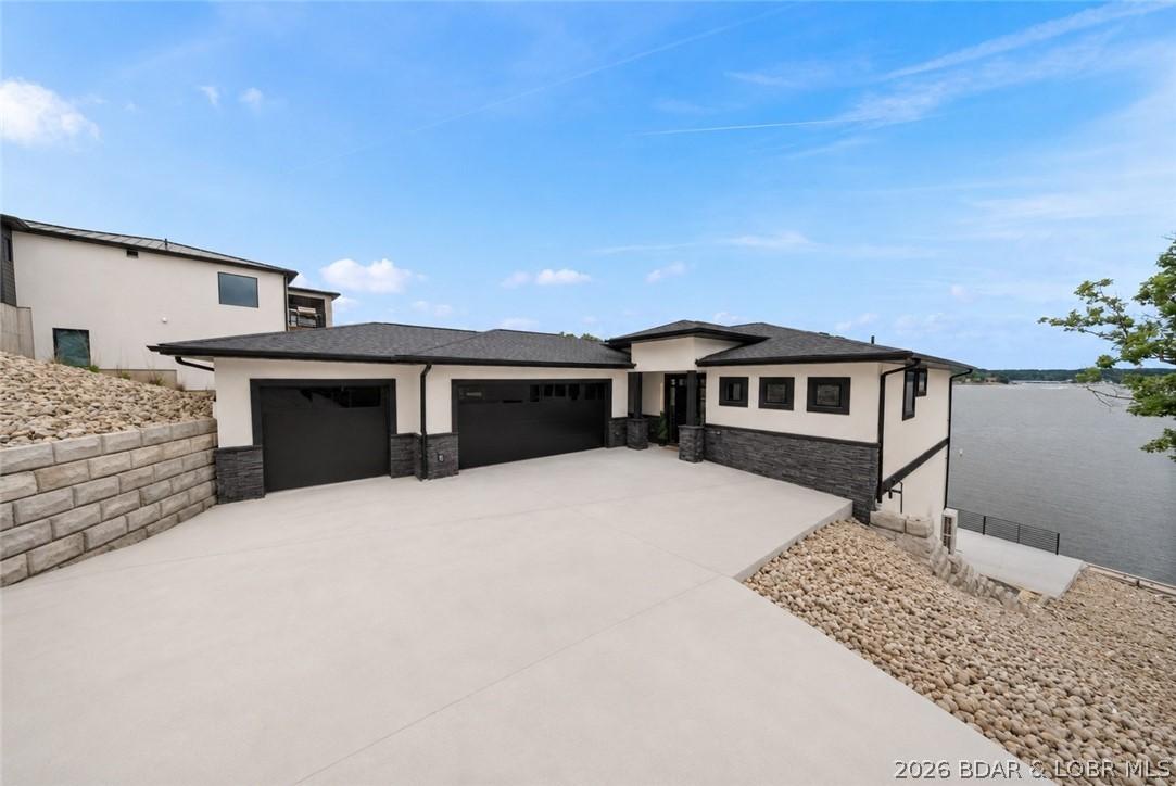 Image 2: Grand front approach with oversized driveway, thre