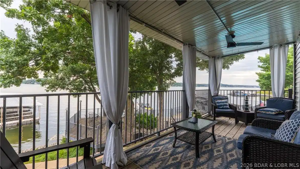 Image 1: Expansive deck featuring ample seating and stunnin