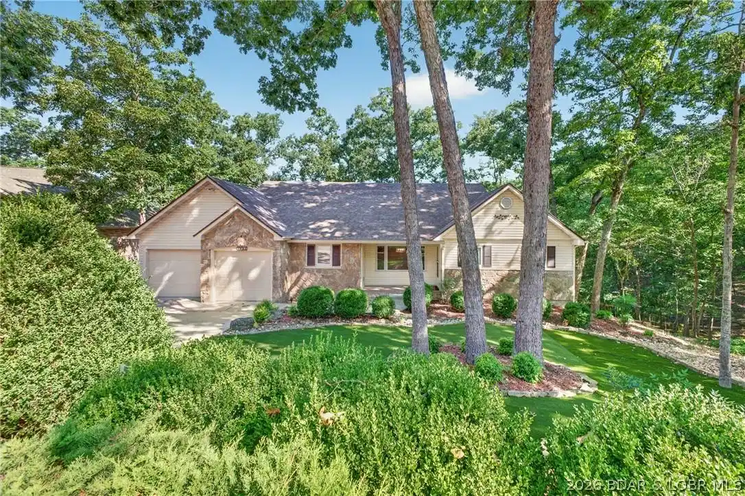 Image 1: Beautiful wood setting with low maintenance landsc