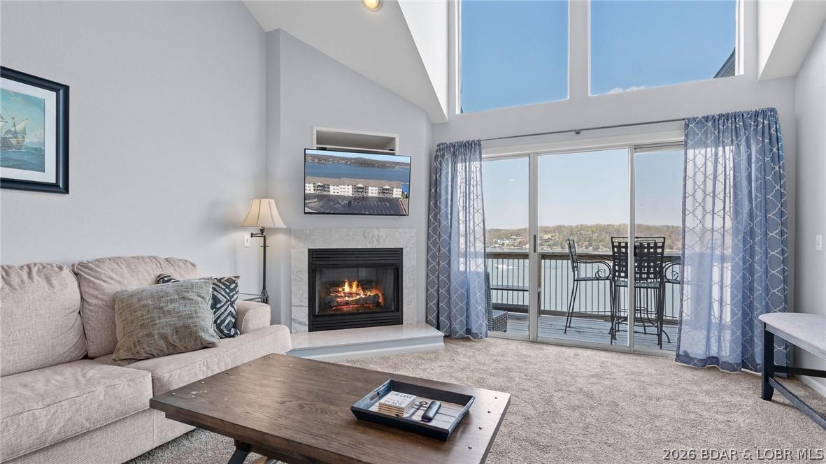 Image 2: Living area with floor to ceiling windows