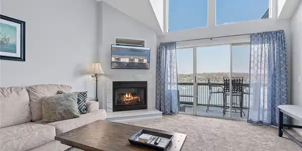 Image 2: Living area with floor to ceiling windows