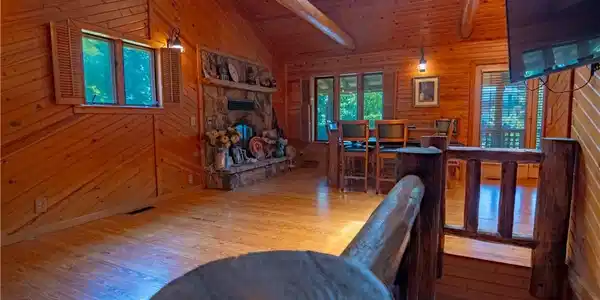 Image 2: Main level living room and dining area.