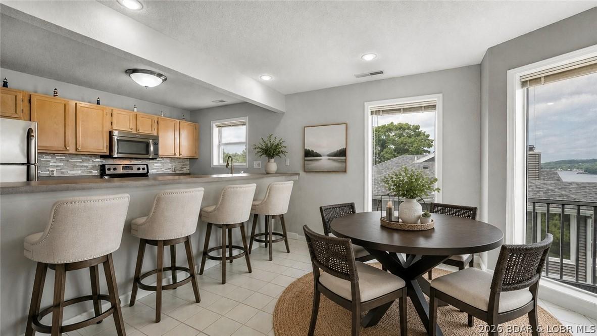 Image 3: AI staged bar stools & table/chairs