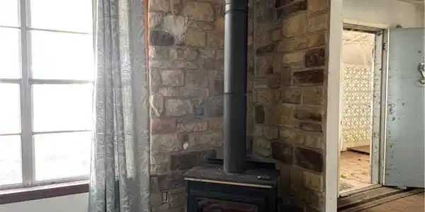 Image 4: Wood Burning Stove in living area.