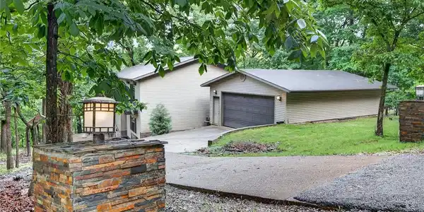 Image 4: Road Side View of Home and Garage
