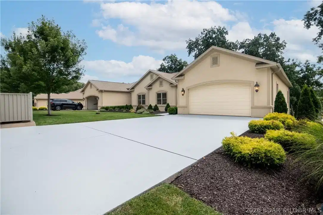 Image 1: Front of the house, with a brand new driveway.
