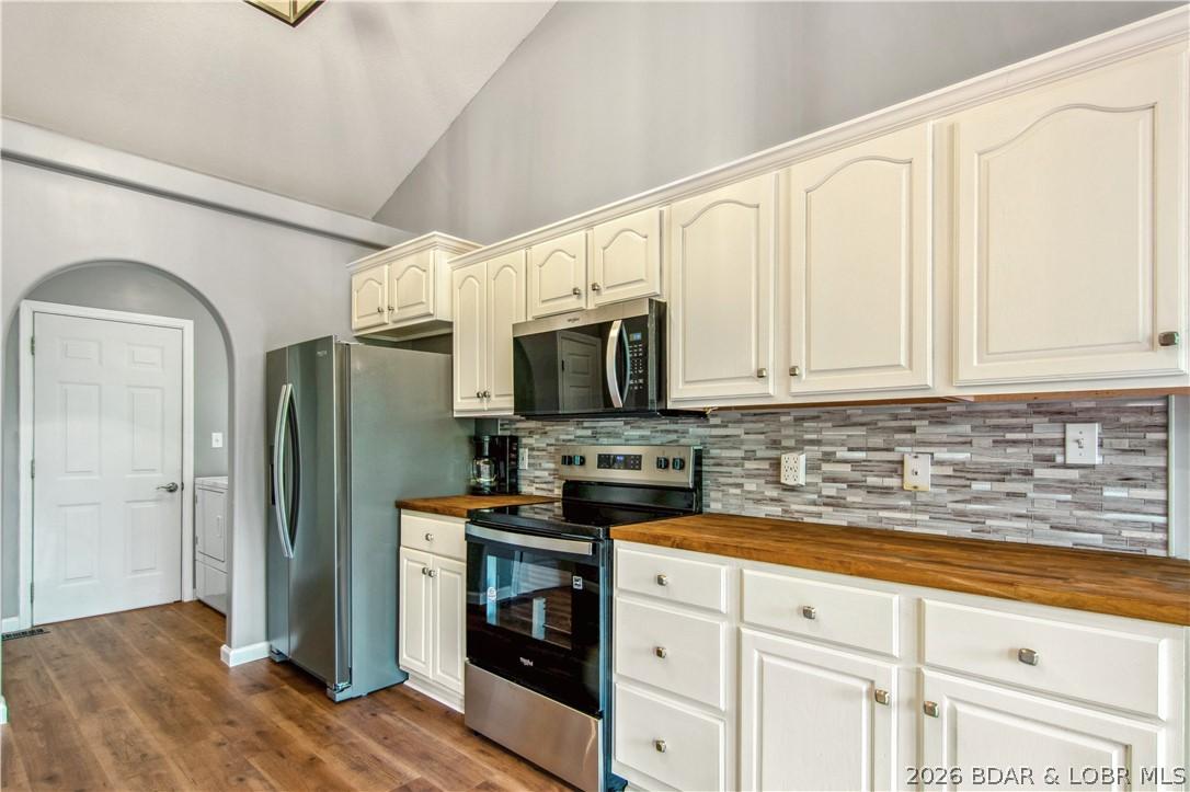 Image 4: The kitchen has been updated with new cabinetry, c