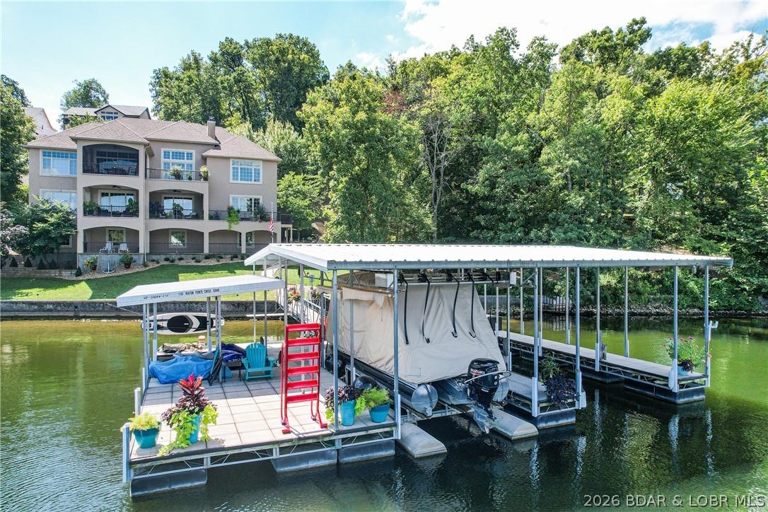Image 3: The dock is perfect with 2 wells, covered PWC spac