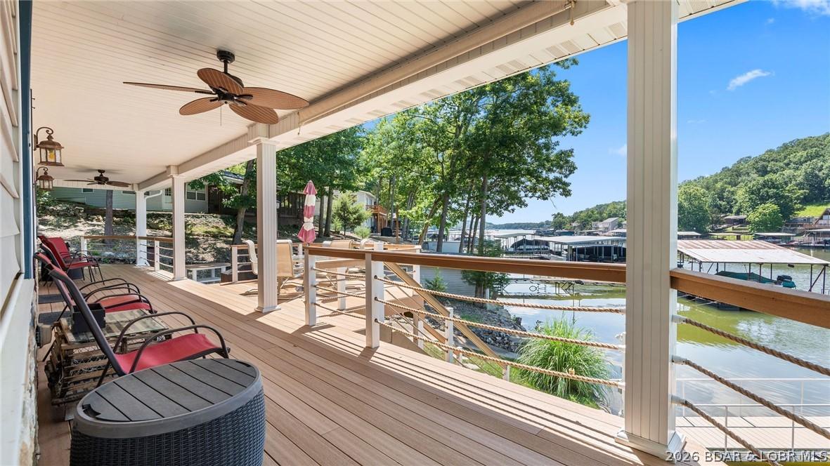 Image 3: Large Covered Deck with a cove location view.