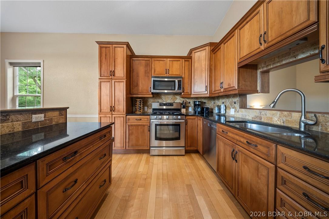 Image 2: Large open concept kitchen with custom cabinets