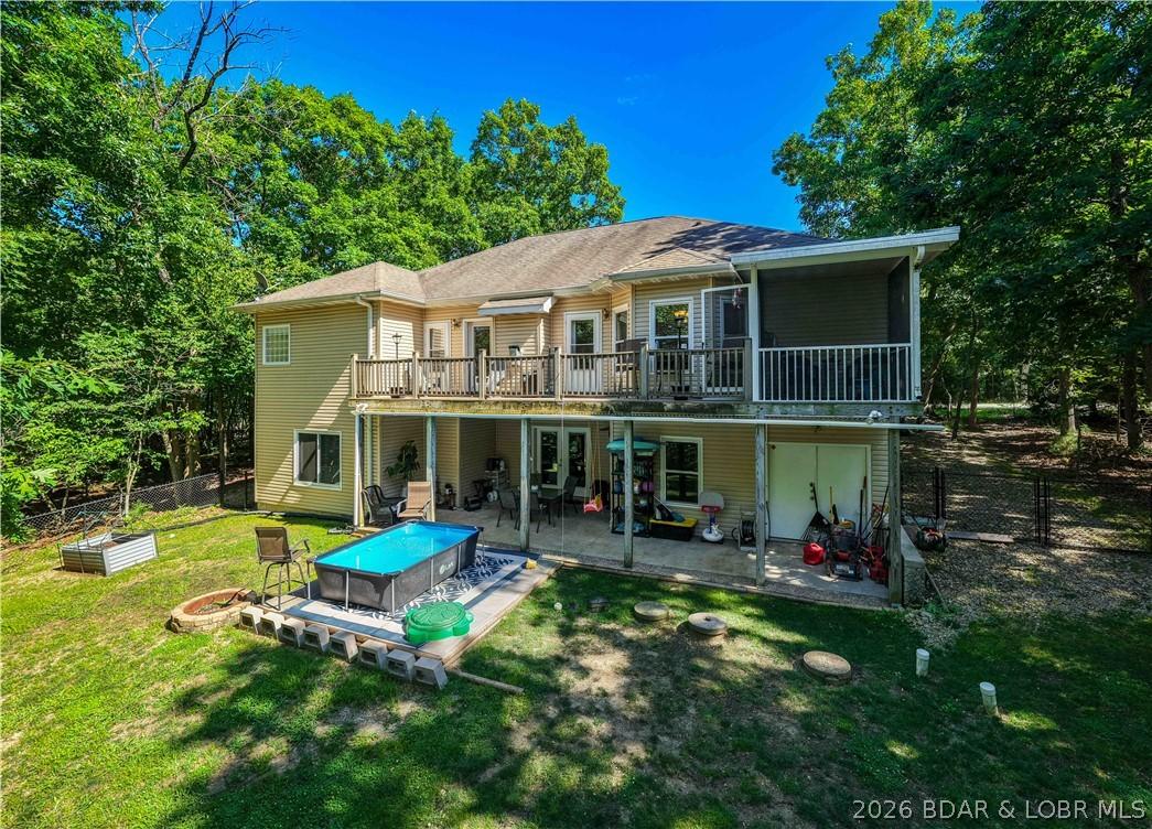 Image 3: Private backyard with expansive deck and covered p