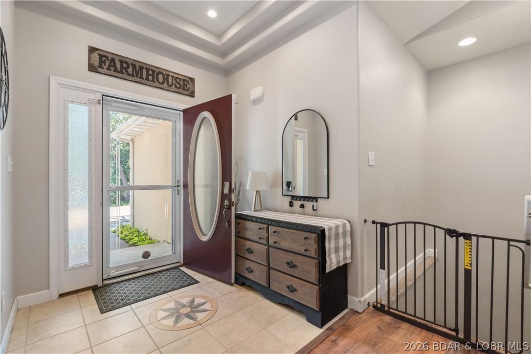 Image 4: Bright entryway with elegant tray ceiling detail