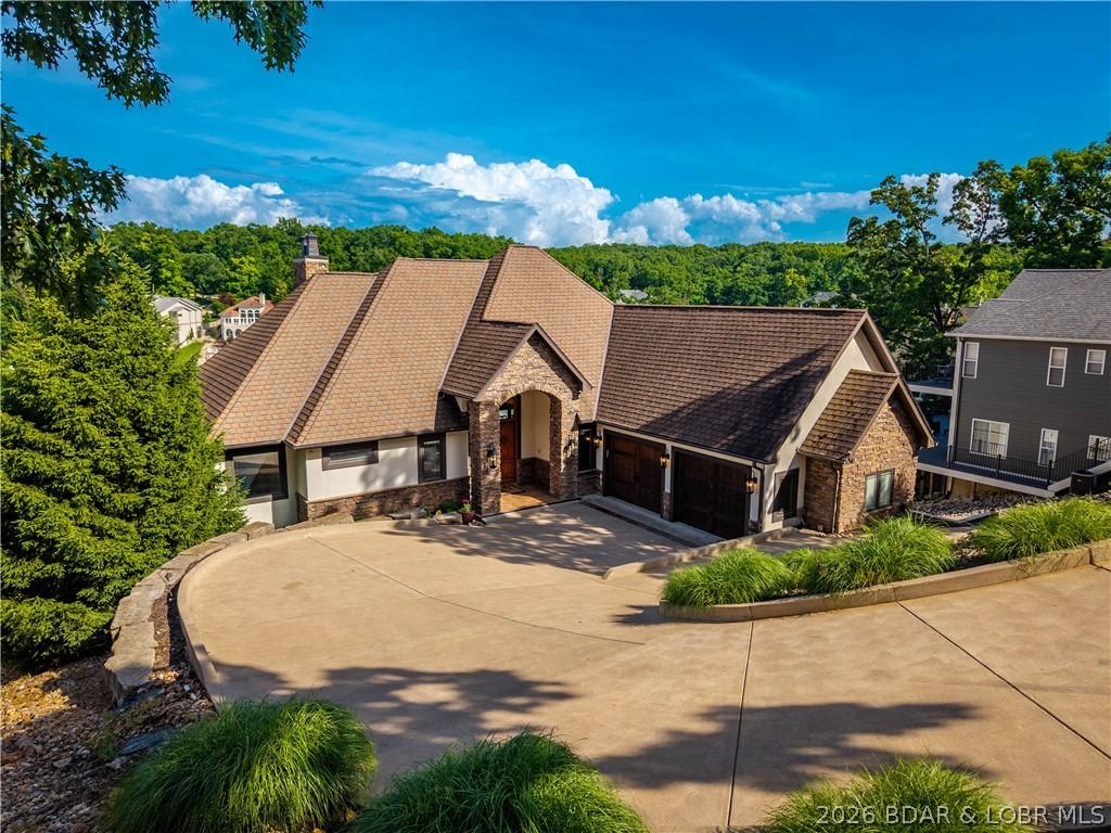 Image 2: Impressive Exterior with golf cart path to the doc