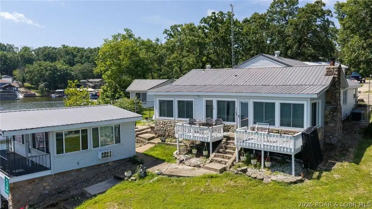 Image 1: home and boathouse
